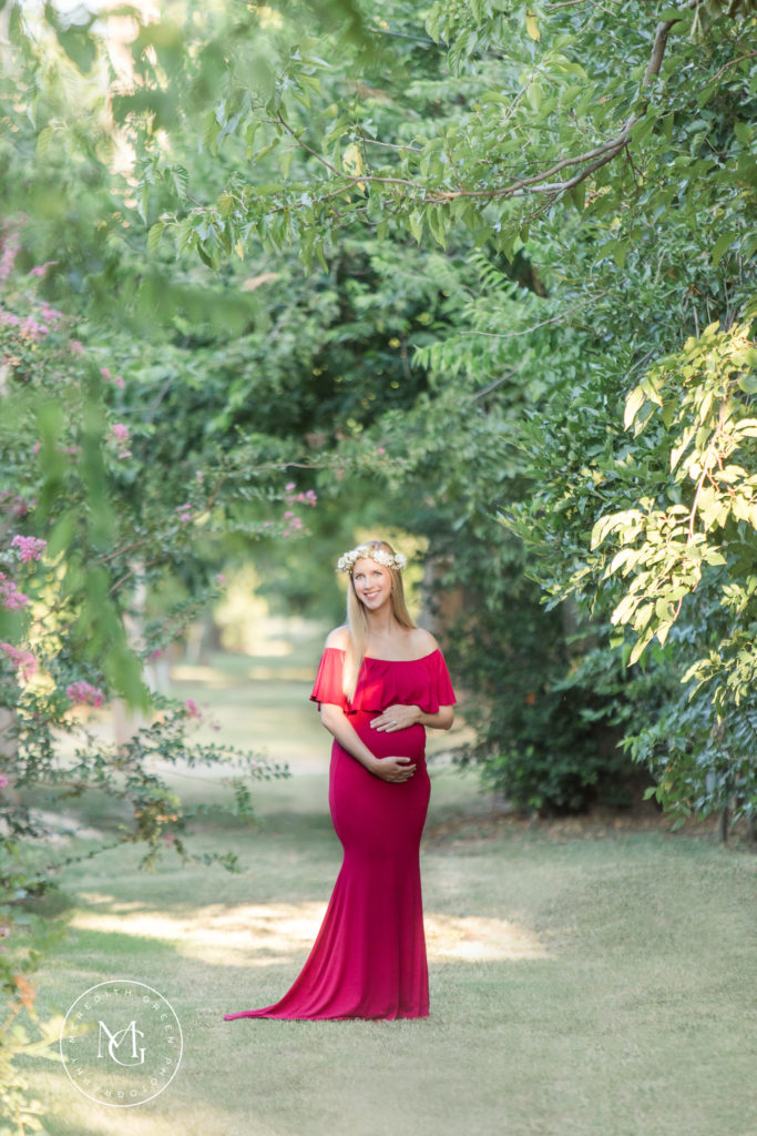 woman dressed in red during maternity session