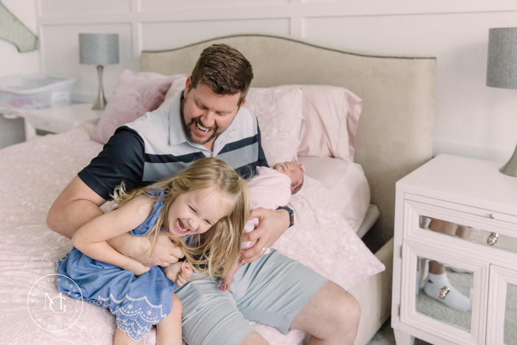 Father with his daughters during newborn lifestyle session