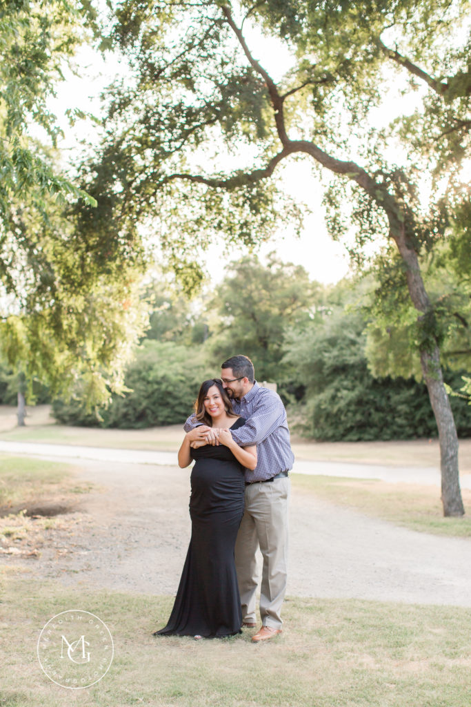 Couple hugging during maternity session