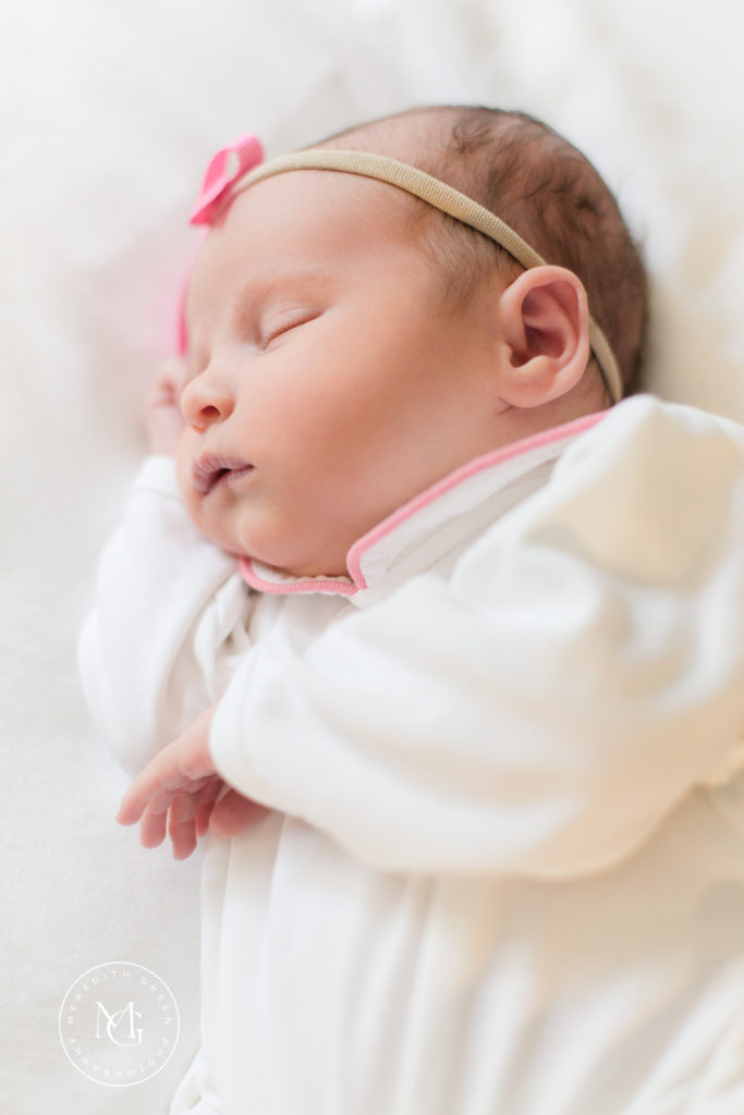 Newborn baby girl sleeping during newborn lifestyle session