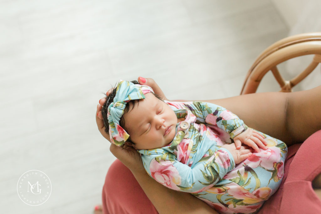 Newborn baby girl during a newborn lifestyle session