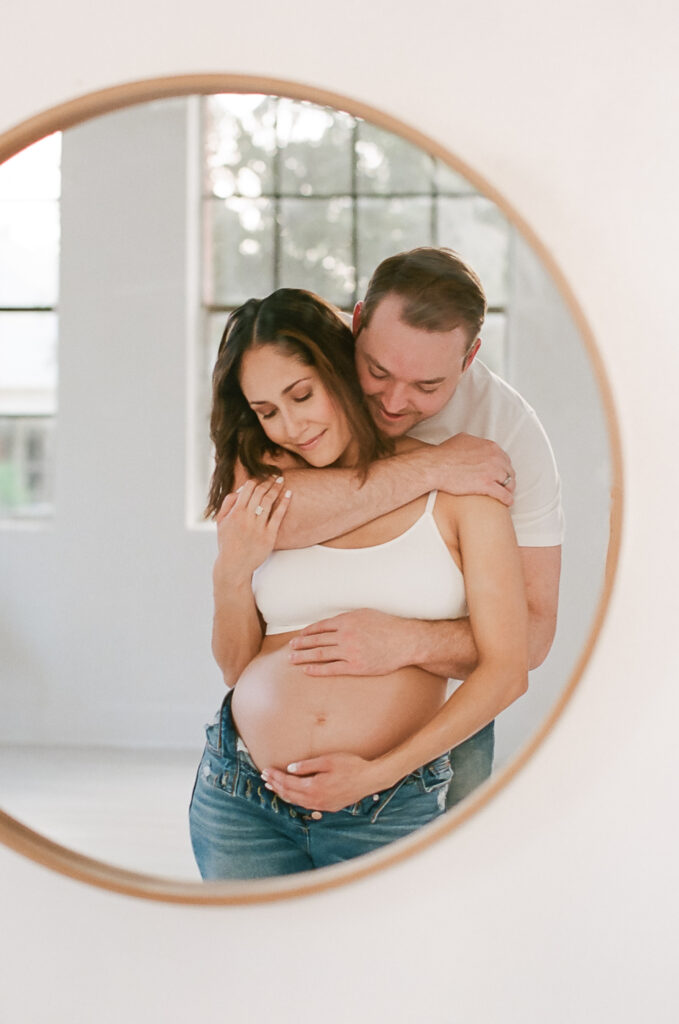 Couple hugging in mirror