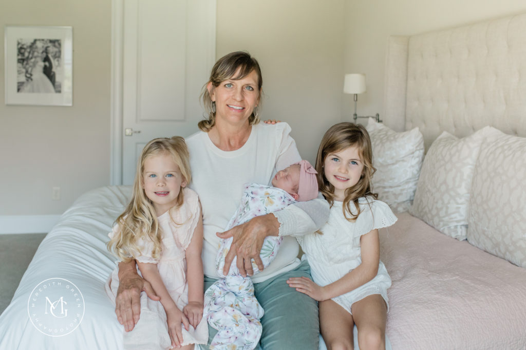 Grandma with her granddaughters during an in home newborn session