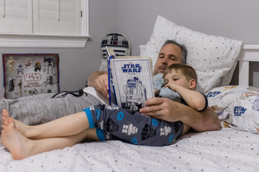 dad reading favorite children's book to son