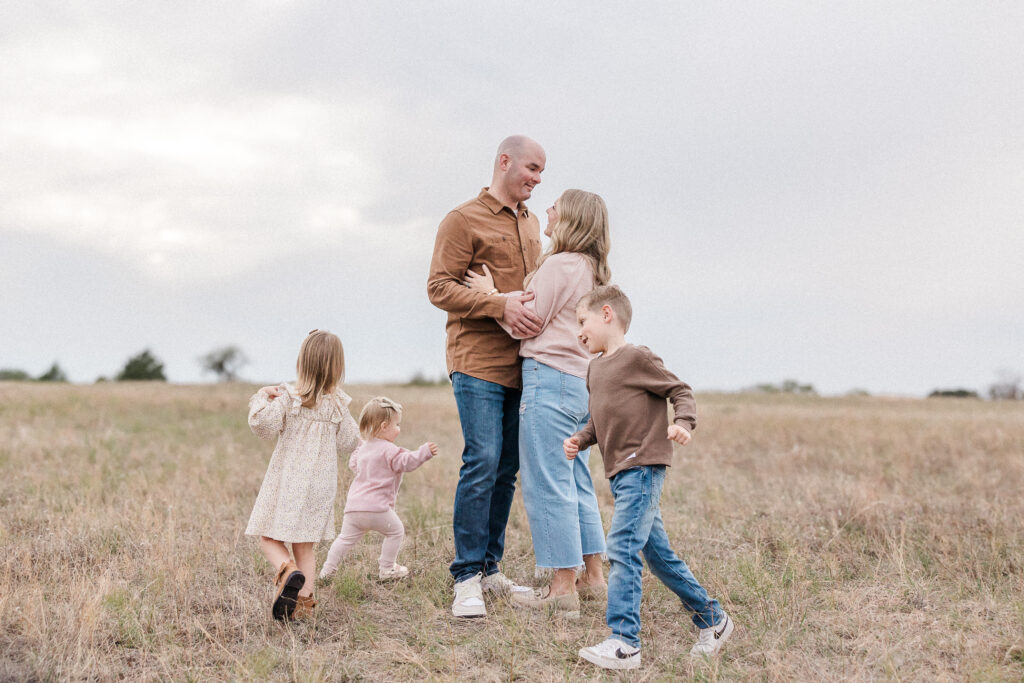 Barry family standing in field for fall family photos