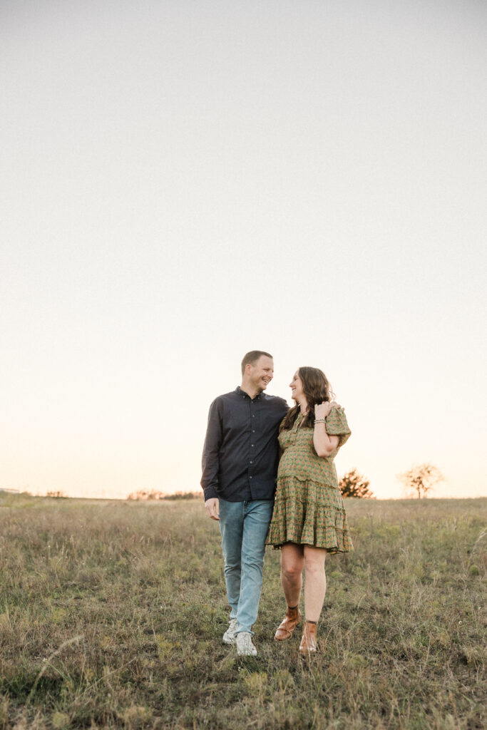 Couple posing for picture during sunset