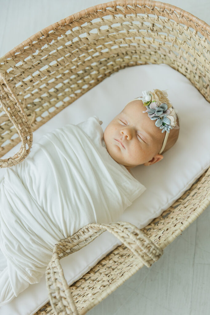 Newborn sleeping in basket