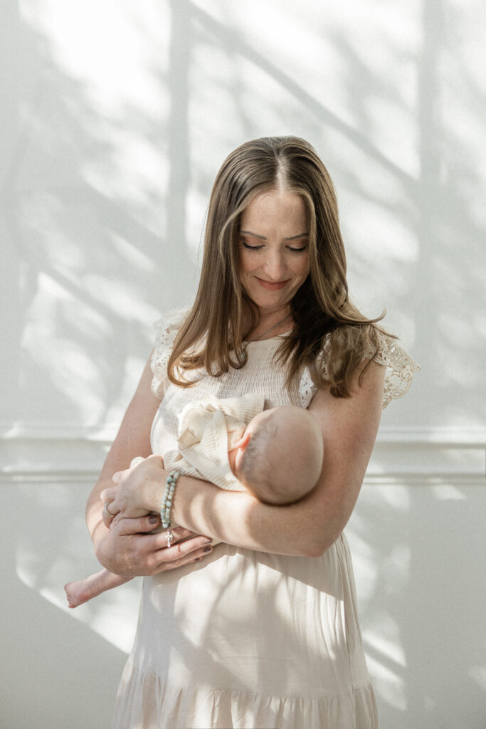 Mom holding newborn daughter